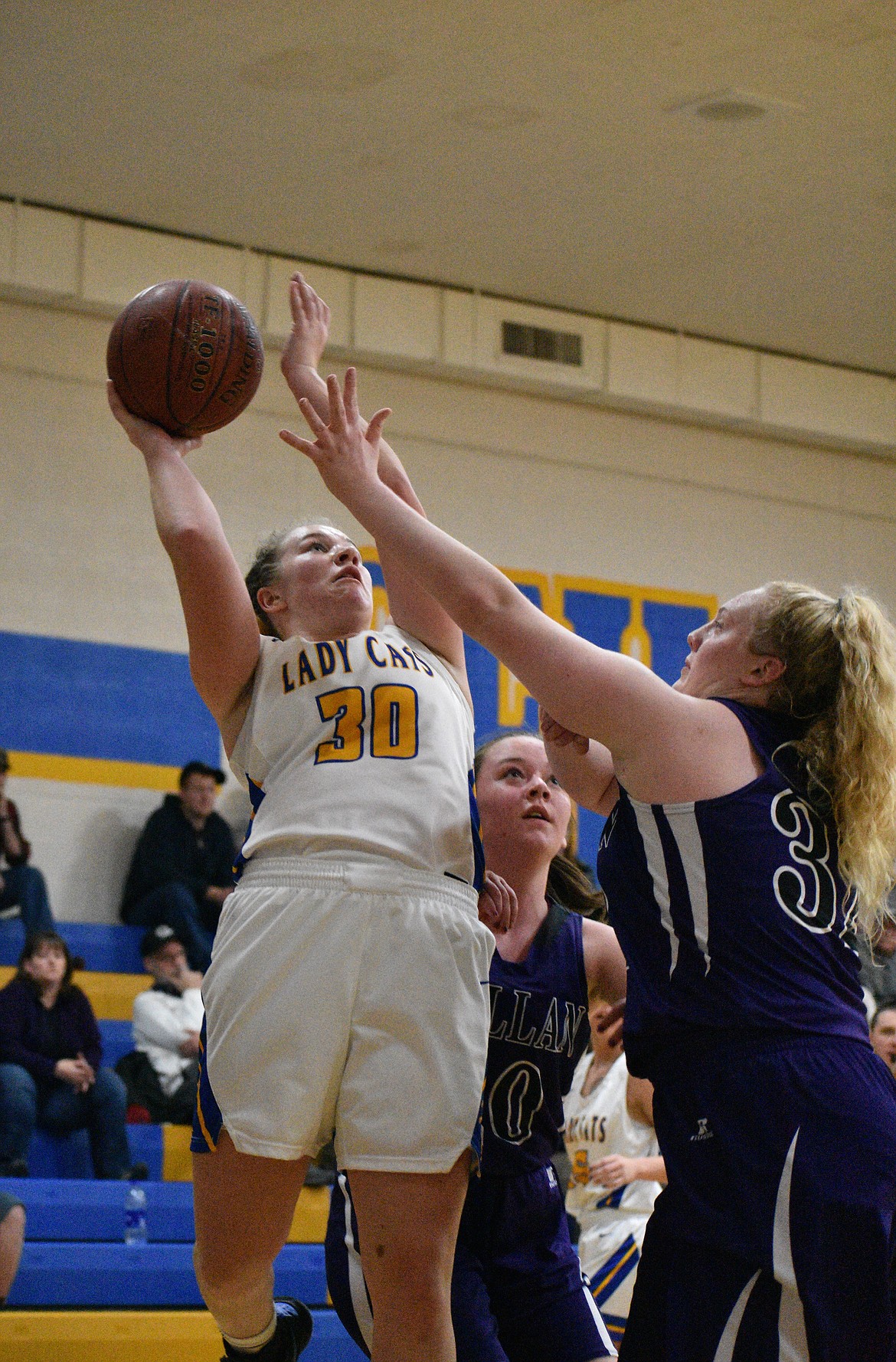 (Photo by DYLAN GREENE) 
 Senior Ellie Kiebert puts up a shot over the outstretched arm of a Mullan defender during a game this year. Kiebert is a finalist for the 3A-1A girls basketball award.