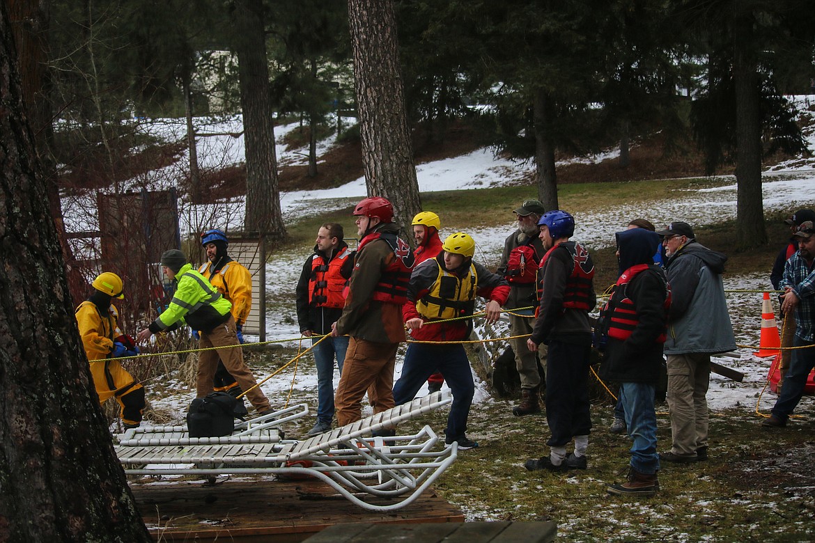 Members from five different fire departments working the ropes.