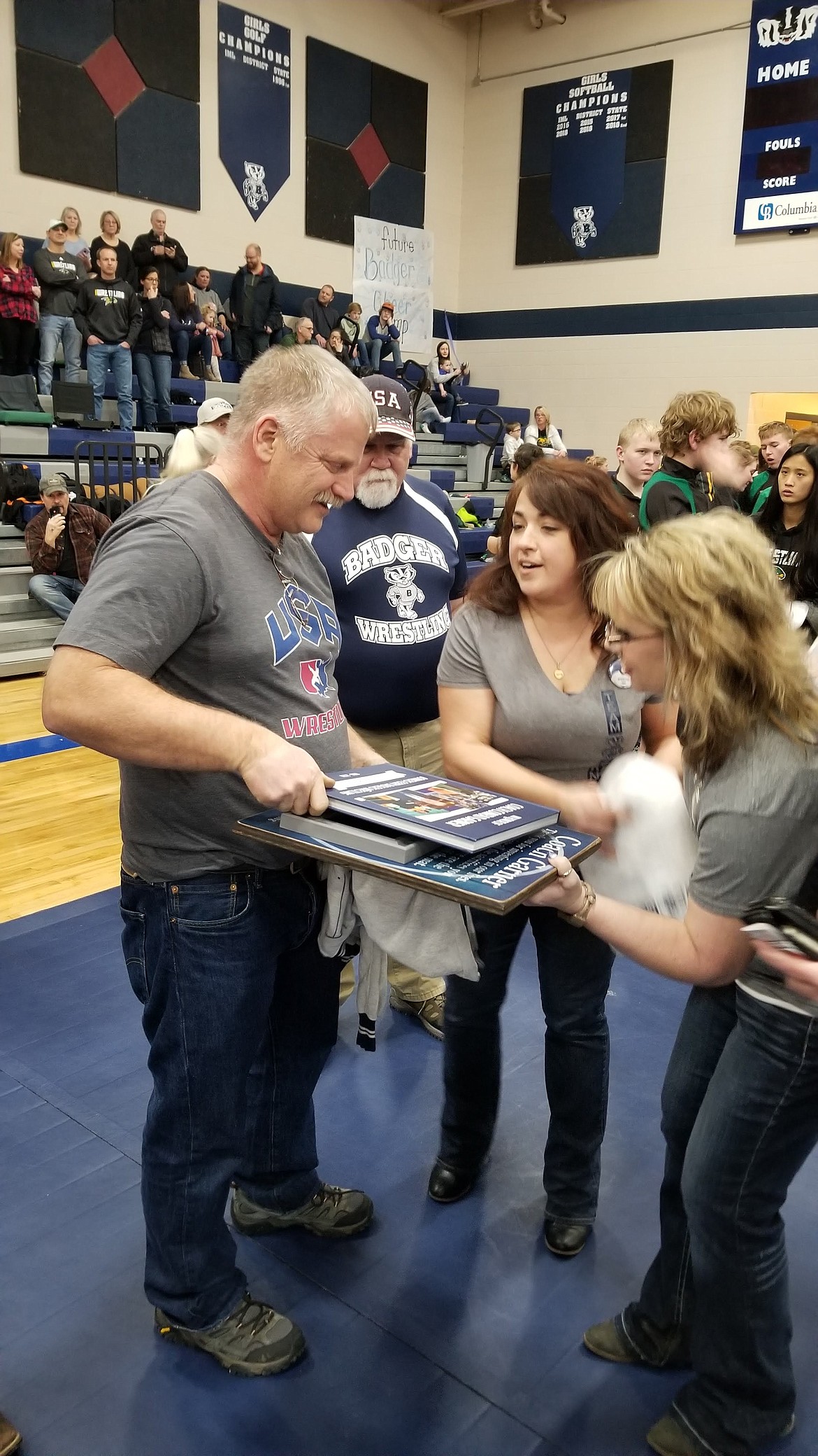 Photo by MANDI BATEMAN 
 Conrad Garner looks at the memory book that he was given.