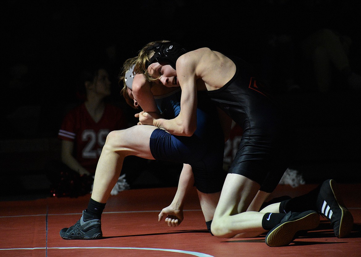 (File photo by DYLAN GREENE) 
 Sandpoint freshman Jacob Albany (right) defeats a Lake City opponent by sudden victory during a dual this season at Les Rogers Court. Albany was voted Most Improved by his teammates.
