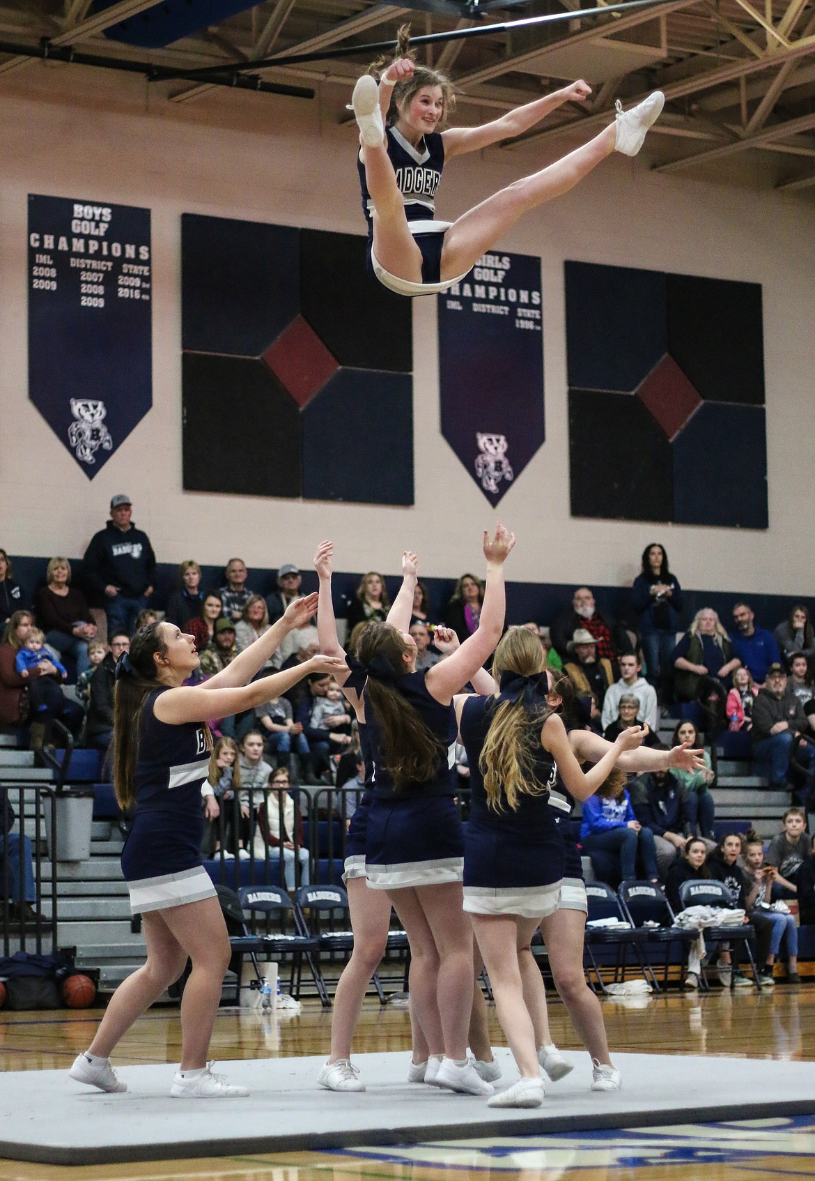 The Badger cheer-leaders thrill the crowd at a recent home game.