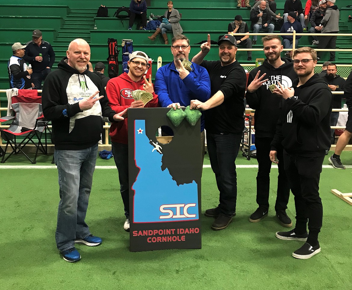 (Photo courtesy of SANDPOINT IDAHO CORNHOLE) 
 Competitive division doubles champions from the January SIC tournament pose for a photo. Pictured (from left): Scott Hottell, Caleb Kitchen, Ernie Bauer, John Mace, Shad Carpenter and Gavin Rex.