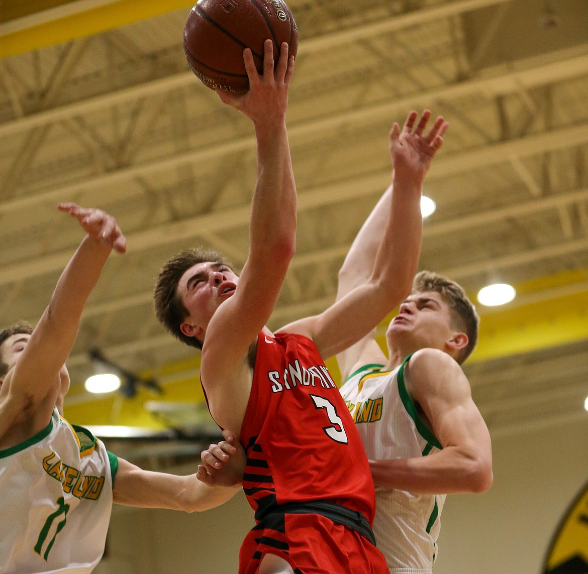 Senior Christian Niemela fights through contact from Lakeland defenders while attacking the rim Thursday night.