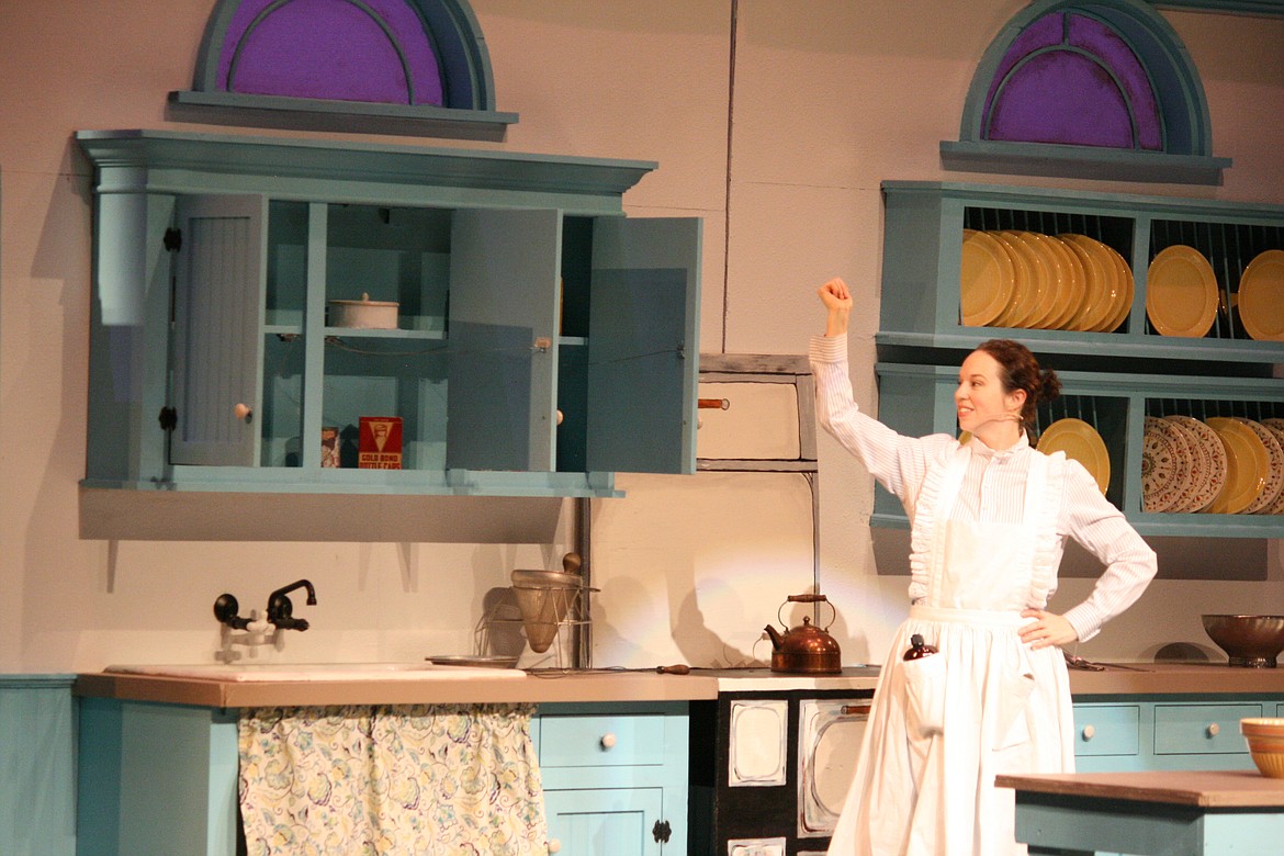 Cheryl Schweizer/Columbia Basin Herald | Mary Poppins’ (Stephanie Moore) medicine is so good it can even straighten up a disheveled kitchen. Quincy Valley Allied Arts is presenting the play, which opens this week.