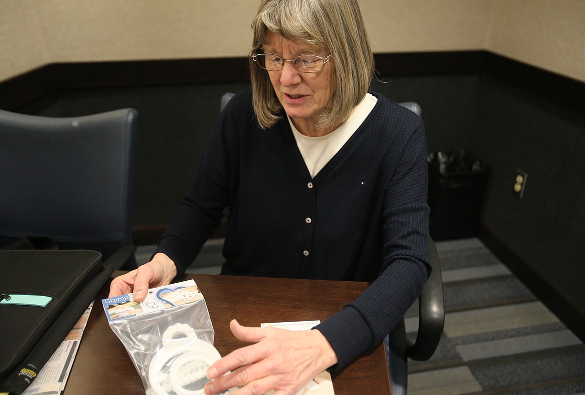 Kathy Jenkins explains how the Stamp Out tool both cuts and crimps dough for filled baked goods. Jenkins donates all money raised from the sales of Stamp Out to help fight human trafficking in Spokan