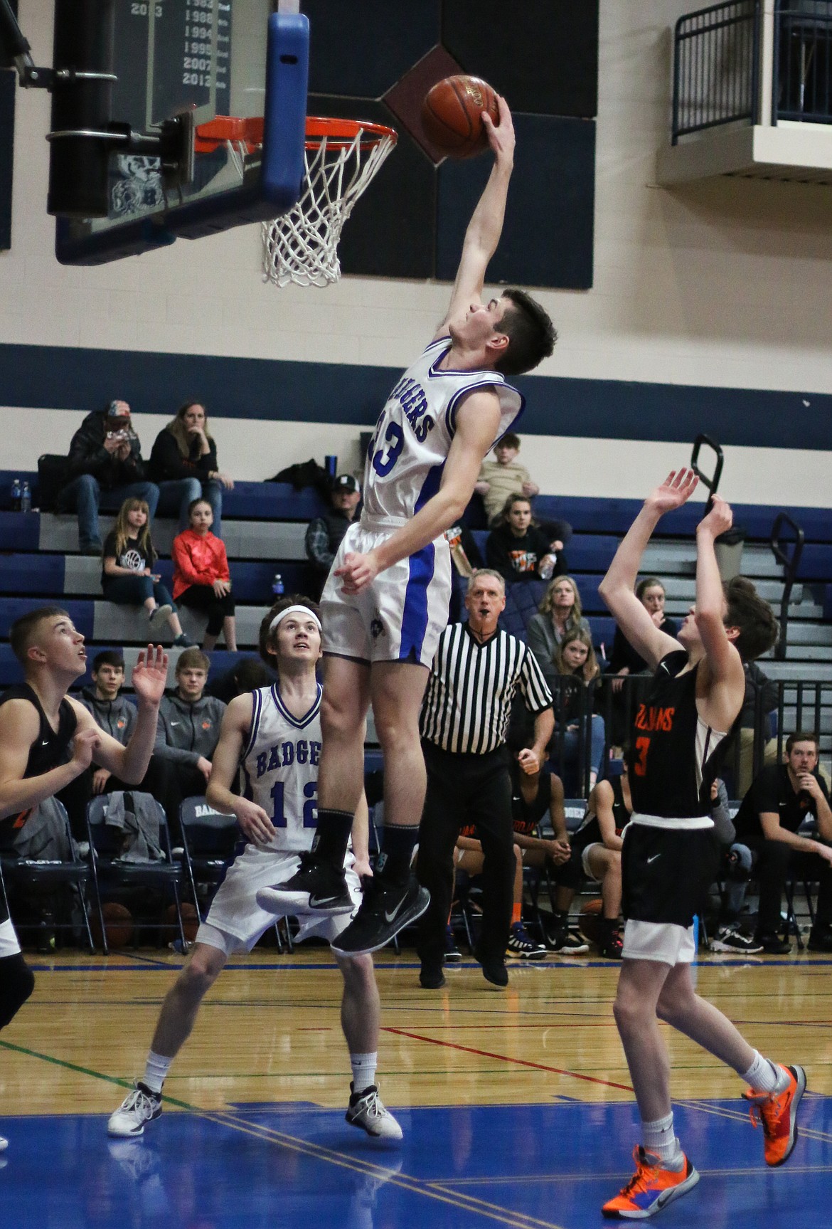 Braeden Blackmore goes for a slam dunk during the Badgers’ Feb. 11 home victory over Priest River.