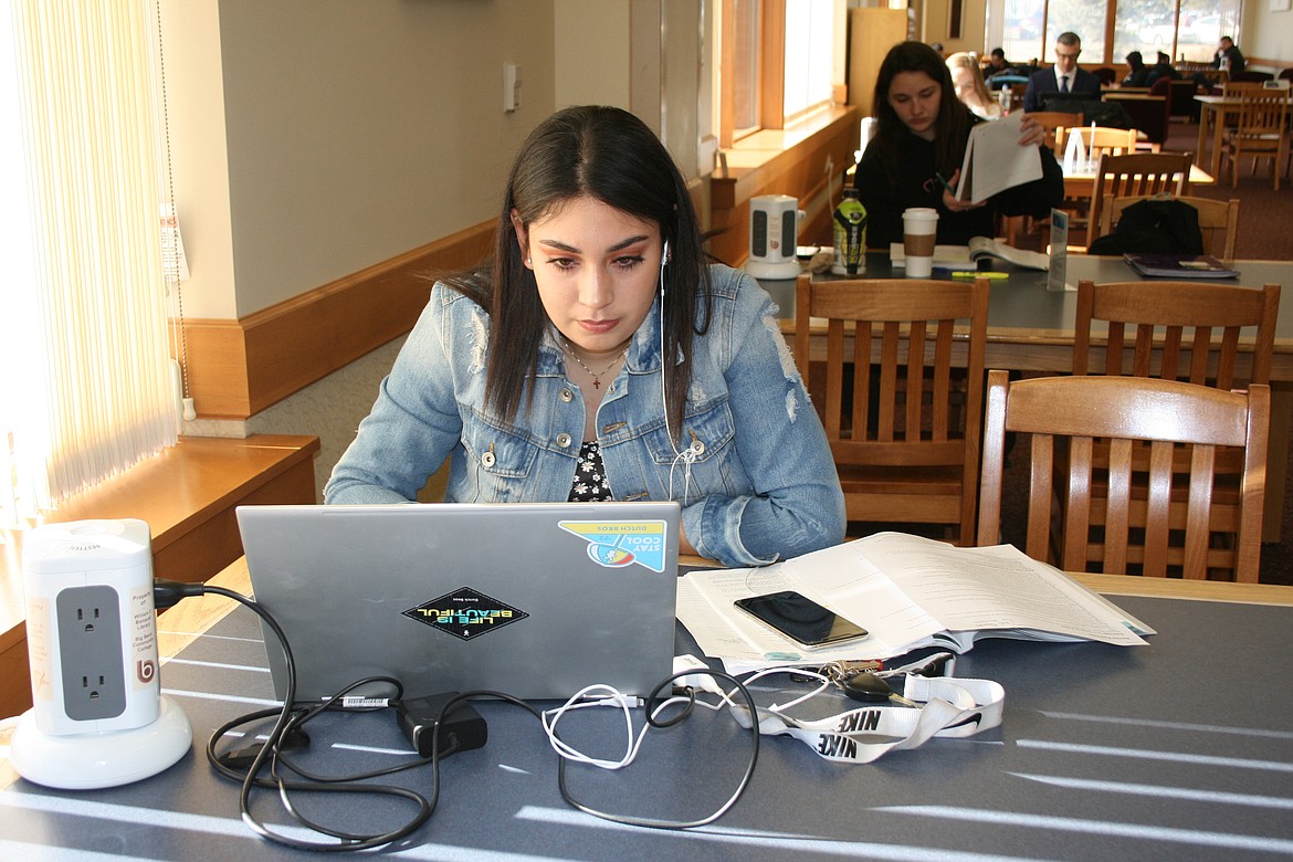 Cheryl Schweizer/Columbia Basin Herald 
 Big Bend Community College student Gaydi Hernandez works on an assignment in the college library Tuesday. Enrollment at BBCC has increased between winter quar