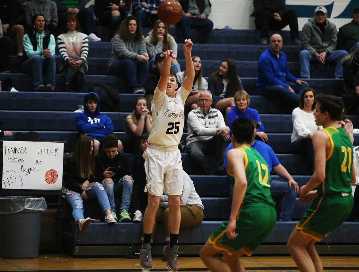 Lake City’s Varick Meredith shoots a 3-pointer during Tuesday’s game against Lakeland High.