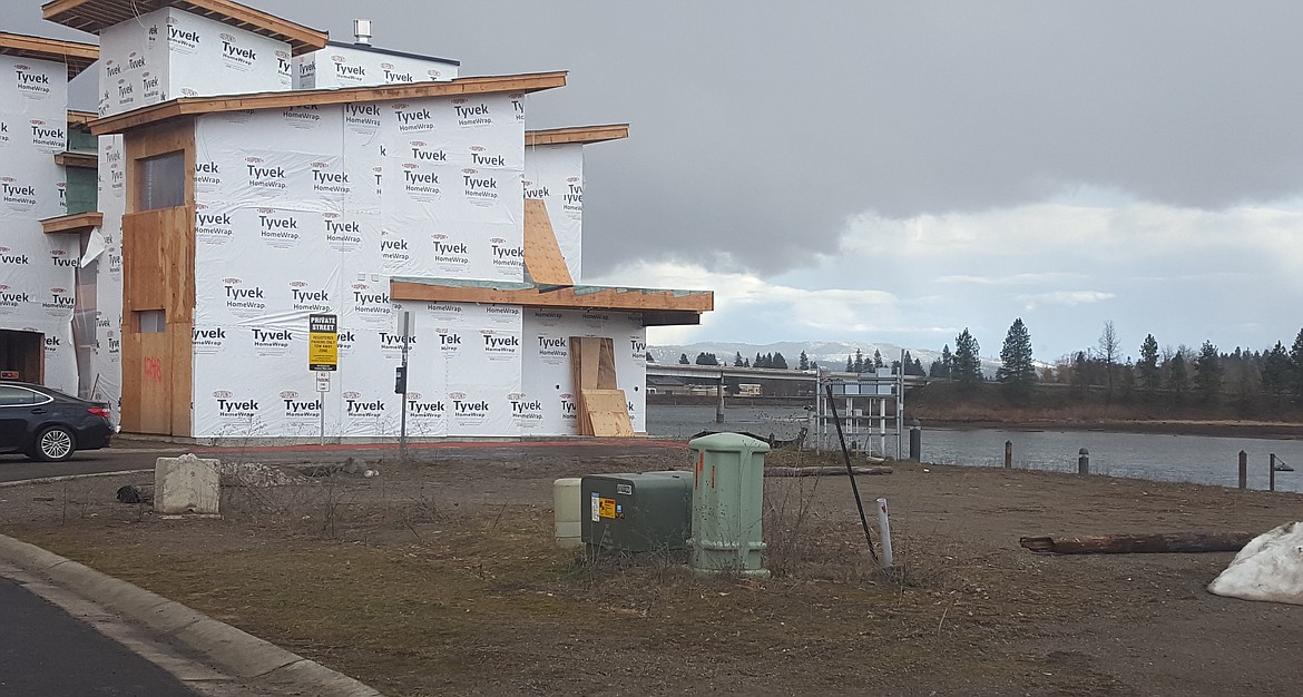 A home under construction on the Spokane River waterfront on Bellerive in Riverstone.