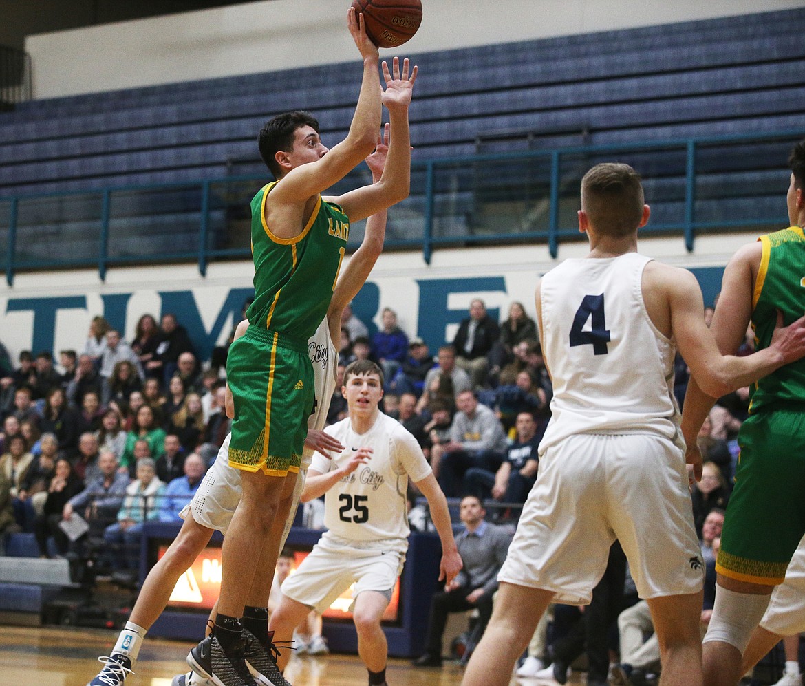 Lakeland High’s Ammon Munyer shoots a two-pointer during a game against Lake City last Tuesday at Lake City High.