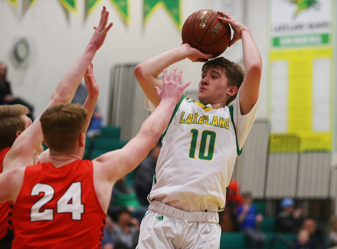 Lakeland High’s Carosn Seay shoots a three pointer against Sandpoint during Monday’s game at Lakeland. (LOREN BENOIT/Press)