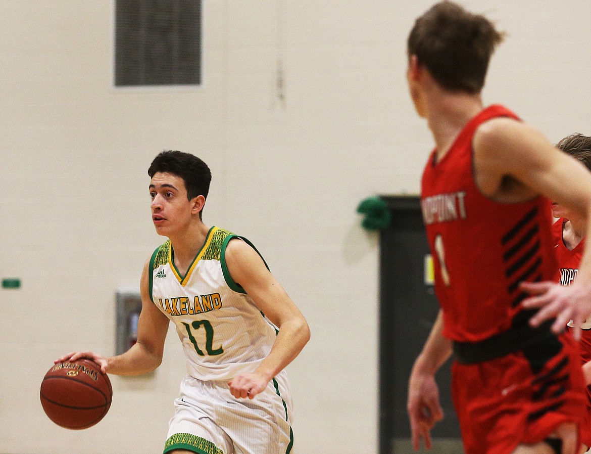 Lakeland High’s Abe Munyer dribbles the ball down the court during Monday’s game against Sandpoint. (LOREN BENOIT/Press)