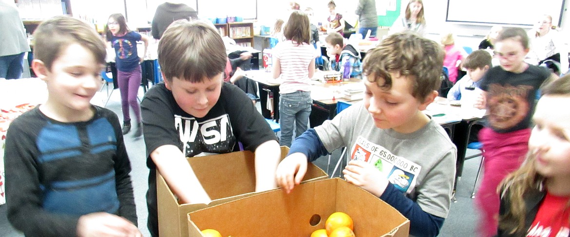 Idaho Hill Elementary students enjoy a snack of oranges thanks to a donation of several boxes of the fruit by one of the school’s child sponsors. The individual recently donated several boxes of fresh oranges from Arizona where he winters. “The kids and staff all enjoyed several of the delicious oranges,” said the school’s Dona Storro.