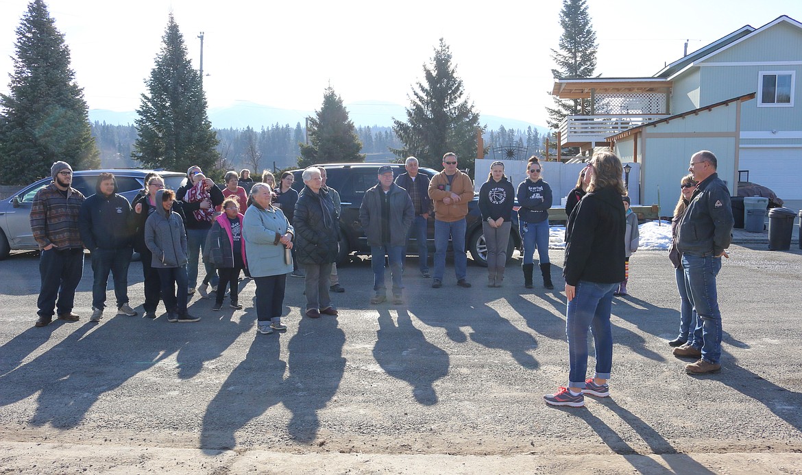 Photo by MANDI BATEMAN 
 BCFCH President, Teresa Rae, speaks to the Wolf family and the gathered crowd consisting of volunteers and supporters.