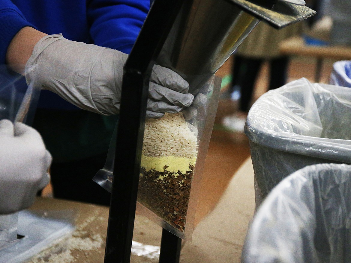 Students at North Idaho Christian spent the day preparing 10,000 meals of rice, soy protein, dehydrated vegetables and vitamins to send to orphanages and schools in Haiti. (LOREN BENOIT/Press)