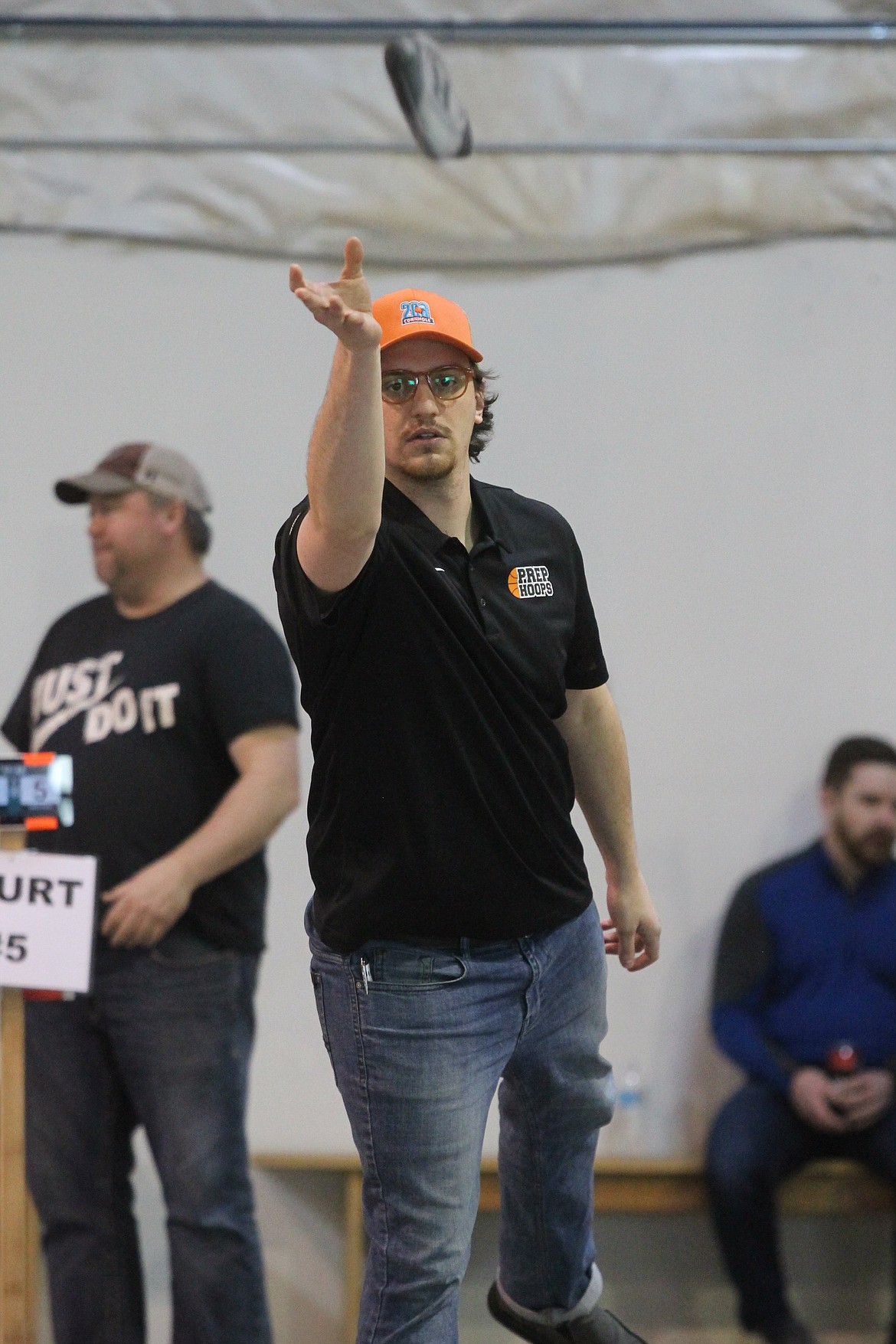 BILL BULEY/Press 
 Shem Hanks is focused as he tosses a bean bag fly in Saturday's cornhole tournament in Post Falls.