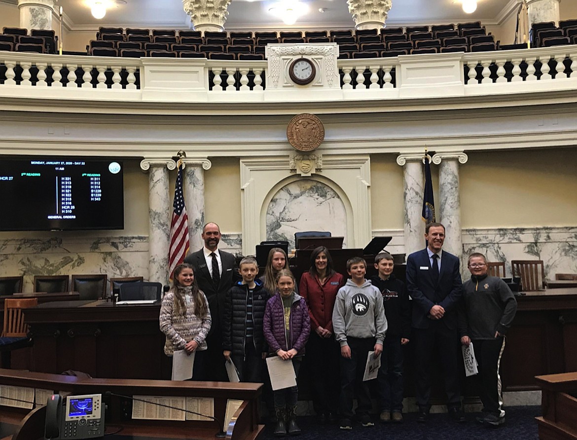 Bonner County Future City students pose with District 1 legislators during a tour of the Capitol building.