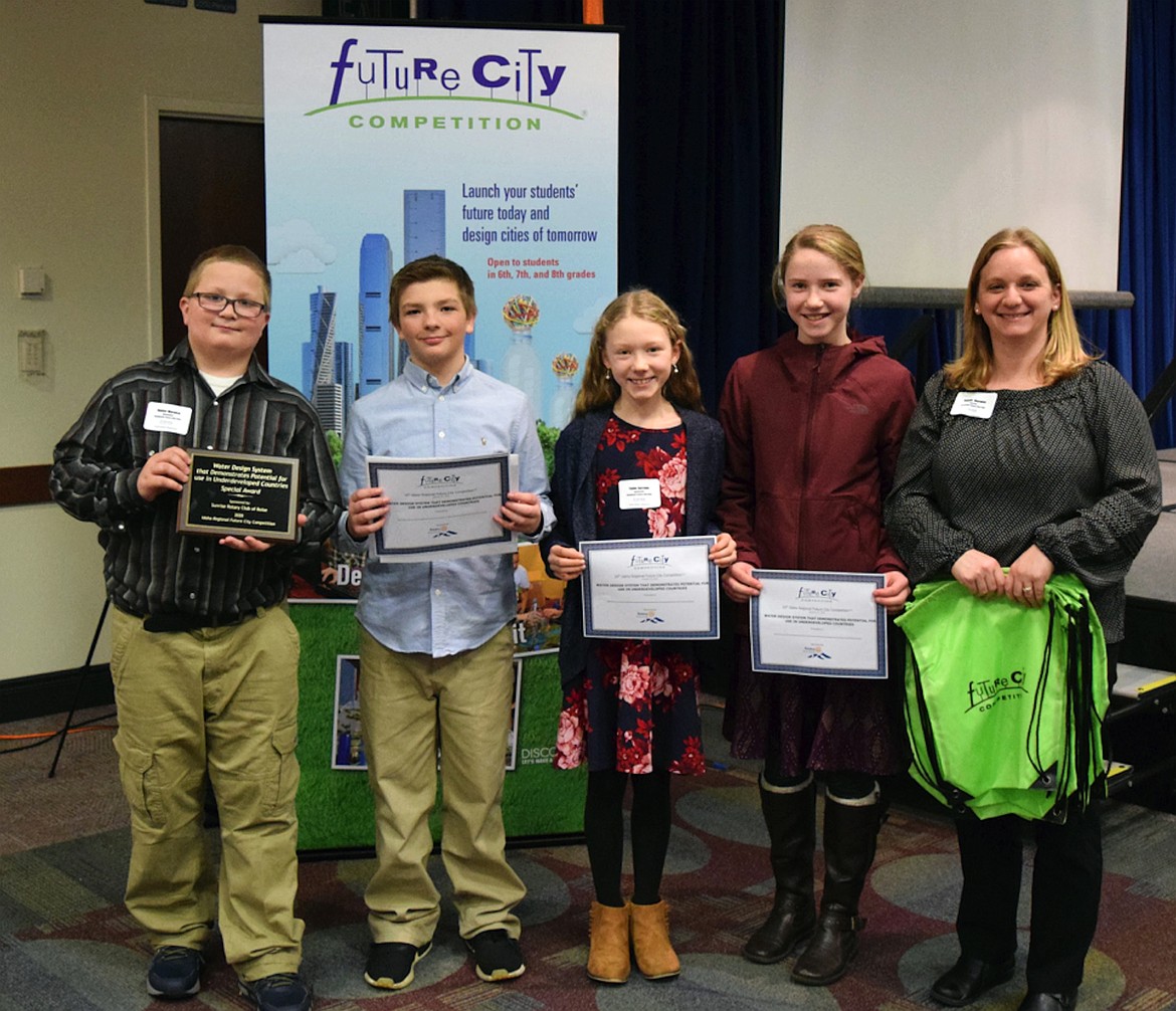 Team Aqualantis made up of Hunter Warwick, Taylor Ailport, Dakota Rief, and Taylor Burrows won the award for water design system that demonstrates potential for use in underdeveloped countries. They are pictured with Northside teacher Jeanne Warwick.