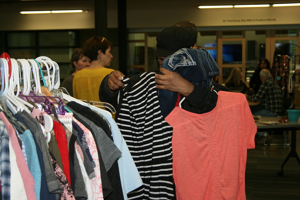 Cheryl Schweizer/Columbia Basin Herald 
  
 Shoppers searched the racks during the "mini-sale" Saturday at Columbia Basin Technical Skills Center.