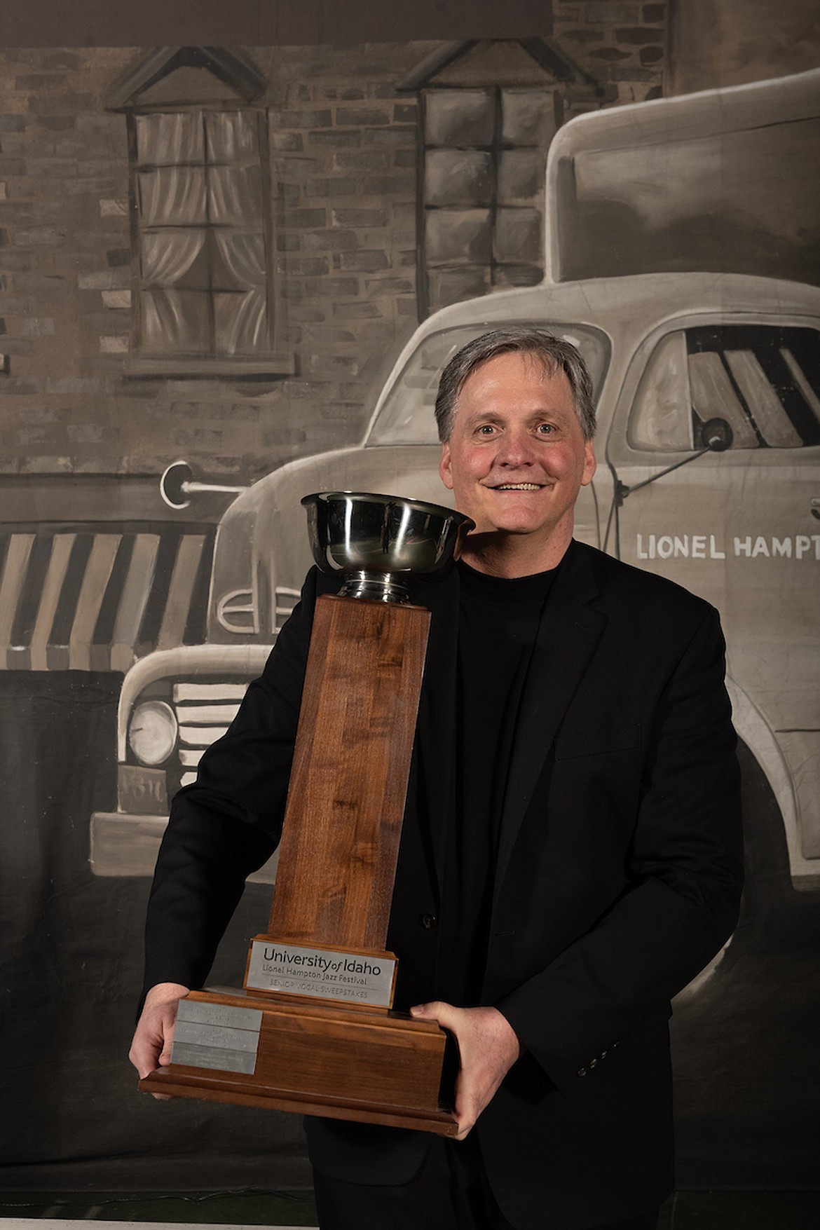 Jon Brownell, director of the Sandpoint High School and Sandpoint Middle School choirs, holds a trophy presented to Sandpoint High School after the school’s Chamber Choir won top honors at the University of Idaho’s 2020 Lionel Hampton Jazz Festival. Both ensembles won honors and a lot of praise at the annual event.