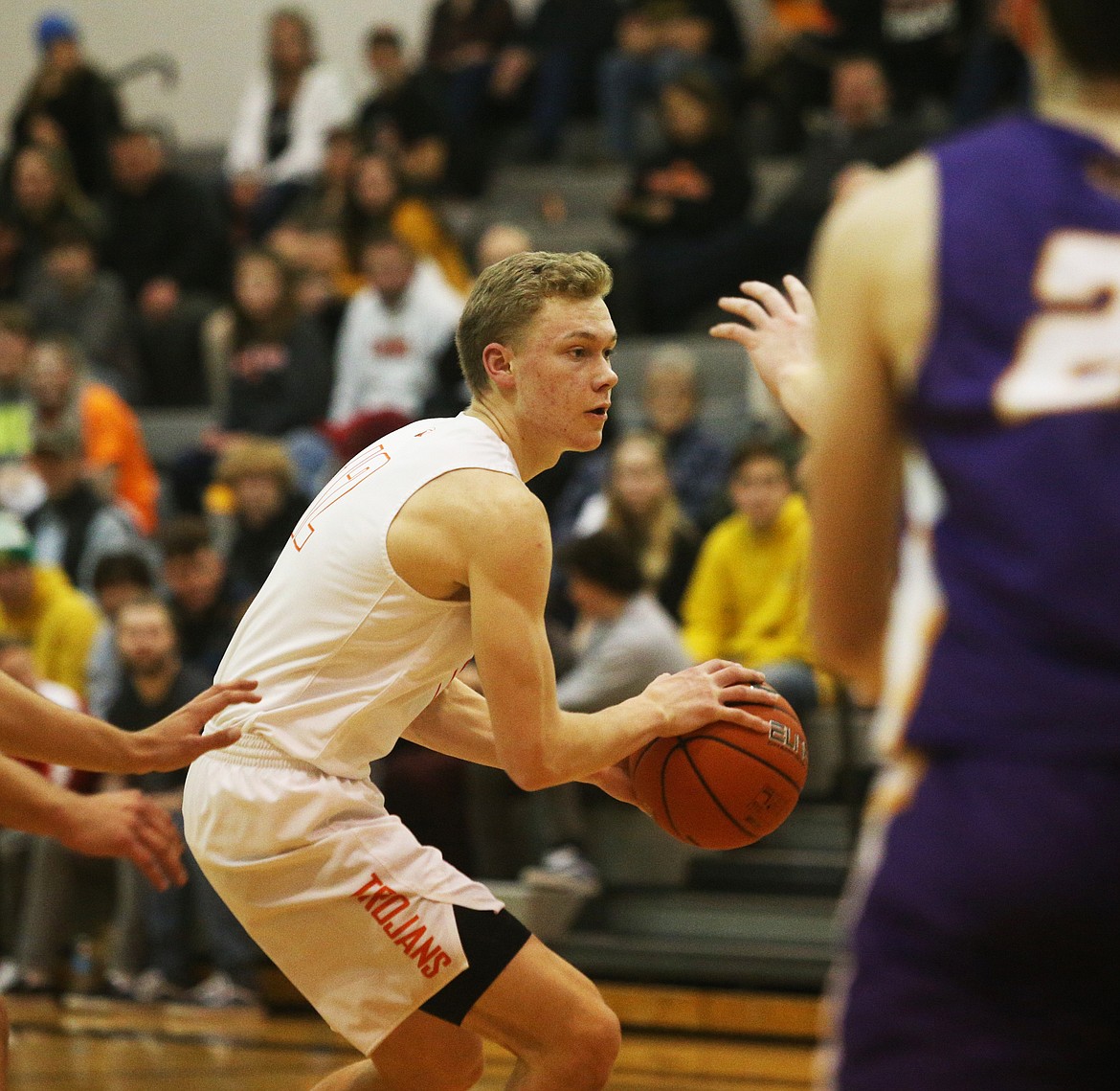 Post Falls High’s Isaac Ballew dribbles the ball toward the paint against Lewiston.