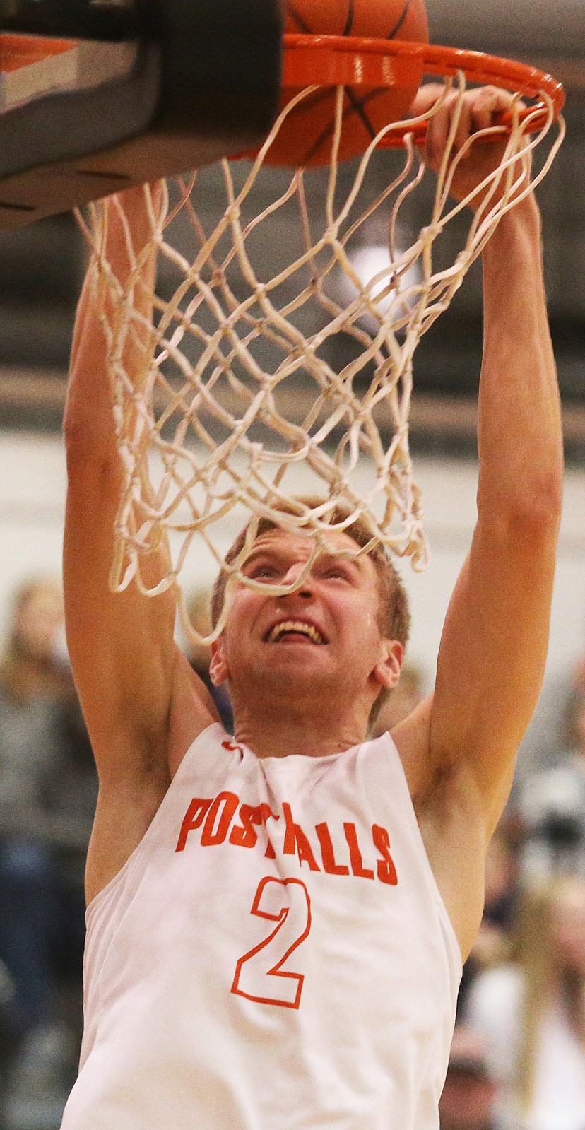 Post Falls’ Colby Gennett dunks the ball during the 5A Region 1 title game.