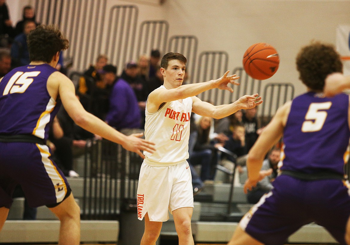 Post Falls’ Cole Rutherford passes the ball to a teammate during the 5A Region 1 championship game against Lewiston.