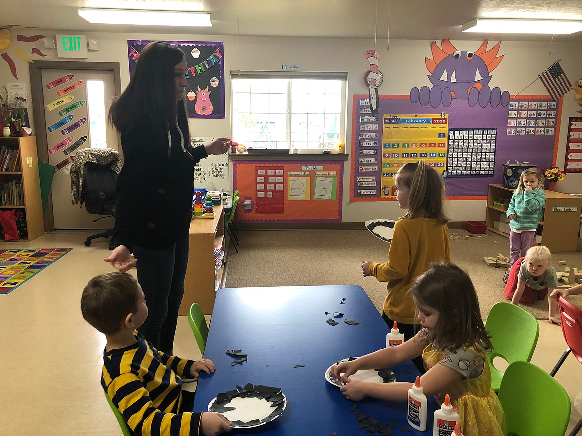 Ashley Lenz directs pre-K students during a craft activity last week at ABCD Daycare in Hayden.
Lenz is the lead teacher at the Hayden location and the daughter of owners Andy and Chris Bjurstrom.