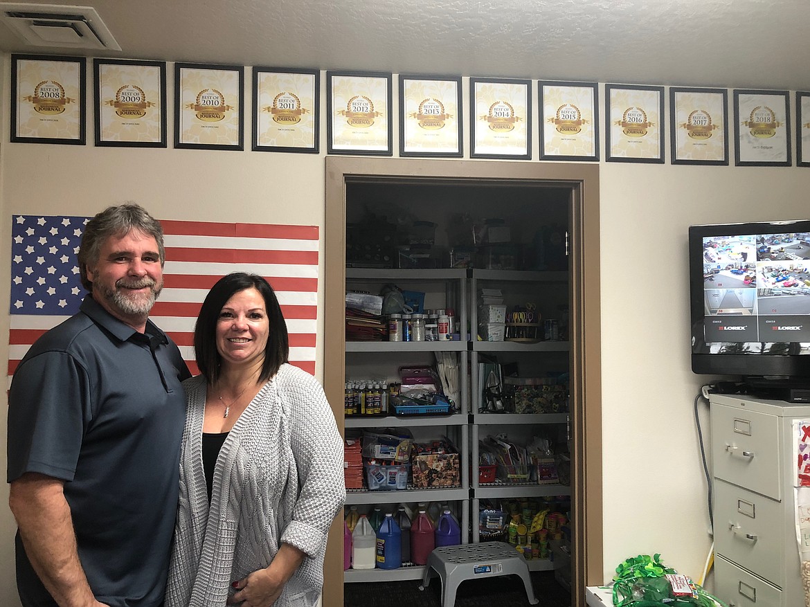 Andy (left) and Chris Bjurstrom stand proudly in front of their “Best of North Idaho” awards, which they won for the 13th consecutive year.