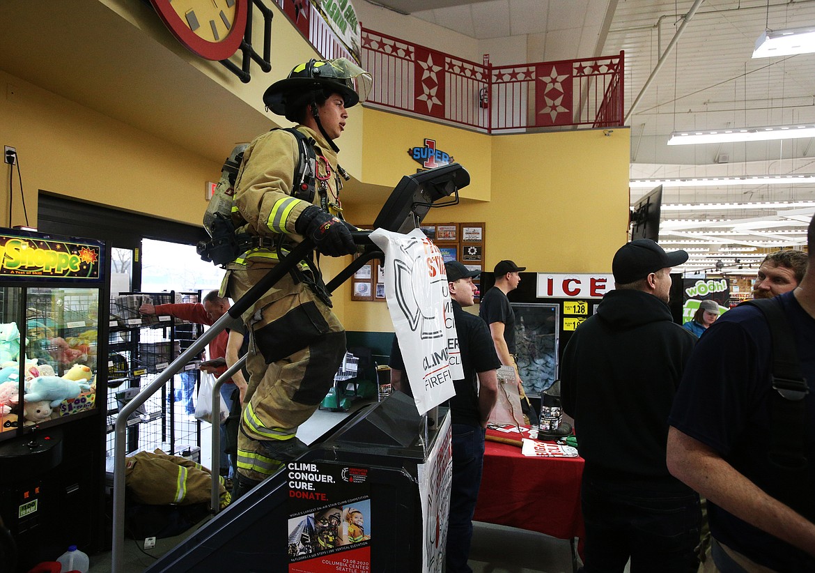Coeur d’Alene firefighter Neko Caballero uses a stairclimb machine to climb 1,356 steps. This weekend’s Leukemia & Lymphoma Society’s Firefighter Stairclimb at the Columbia Center in Seattle was canceled due to coronavirus worries. North Idaho firefighters will be making their way up Canfield Mountain, starting at 10 a.m. Sunday.