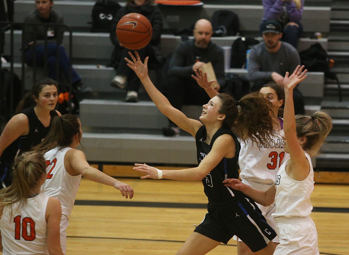 Coeur d’Alene’s Jaelyn Brainard goes for a layup through the Post Falls defense in a game at Post Falls High School on Jan. 14.