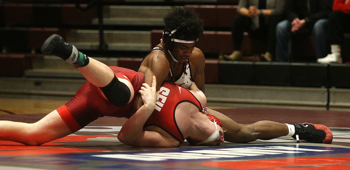 North Idaho College’s Izaiah Duran turns the shoulder of Simon Fraser’s Zach Stratton in a 165-pound match on Feb. 7.