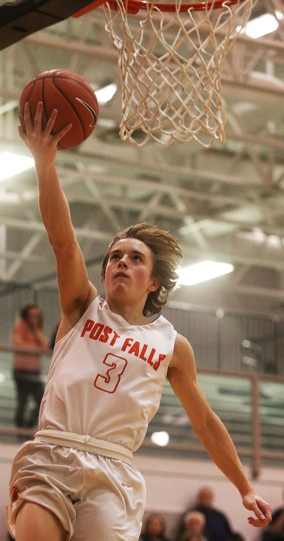 Post Falls’ Caden McLean scores a breakaway basket in the 5A Region 1 championship game against Lewiston on Feb. 26.