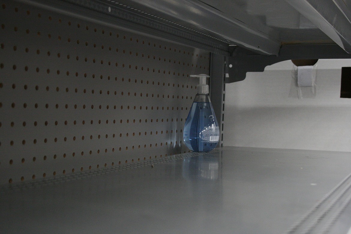 Cheryl Schweizer/Columbia Basin Herald 
  
 A lone bottle of hand sanitizer sits on the shelf at the Moses Lake Walmart Friday. Shelves were bare of hand sanitizers, among other supplies, and some stores have begun to limit purchases.