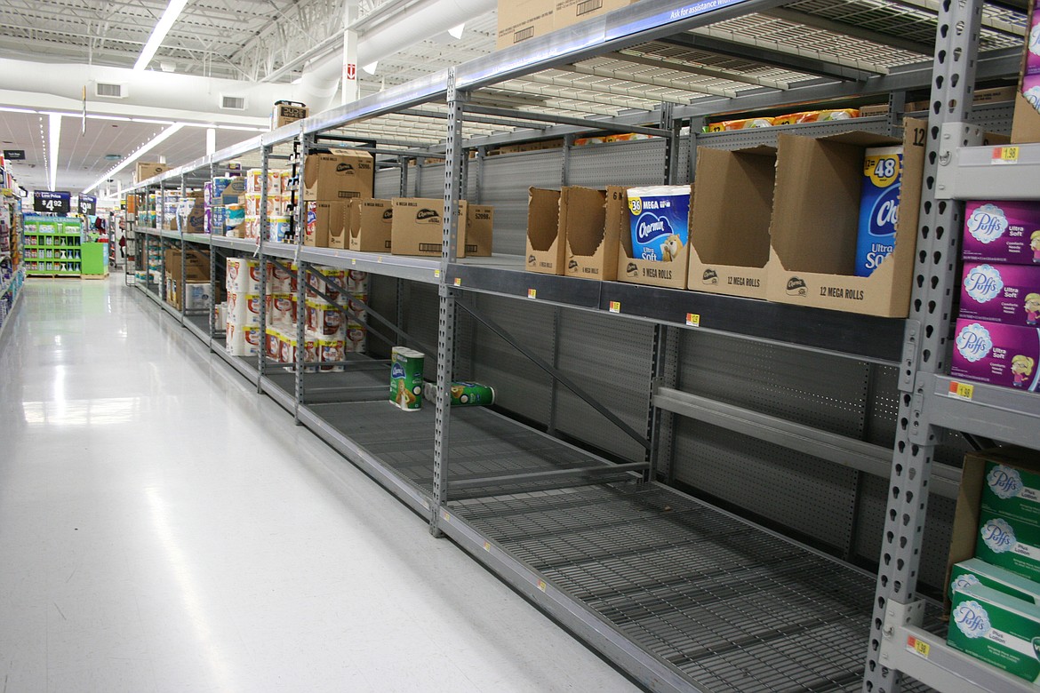 Cheryl Schweizer/Columbia Basin Herald 
  
 While not completely empty, the shelves in the toilet paper aisle of the Moses Lake Walmart were pretty bare Friday morning.