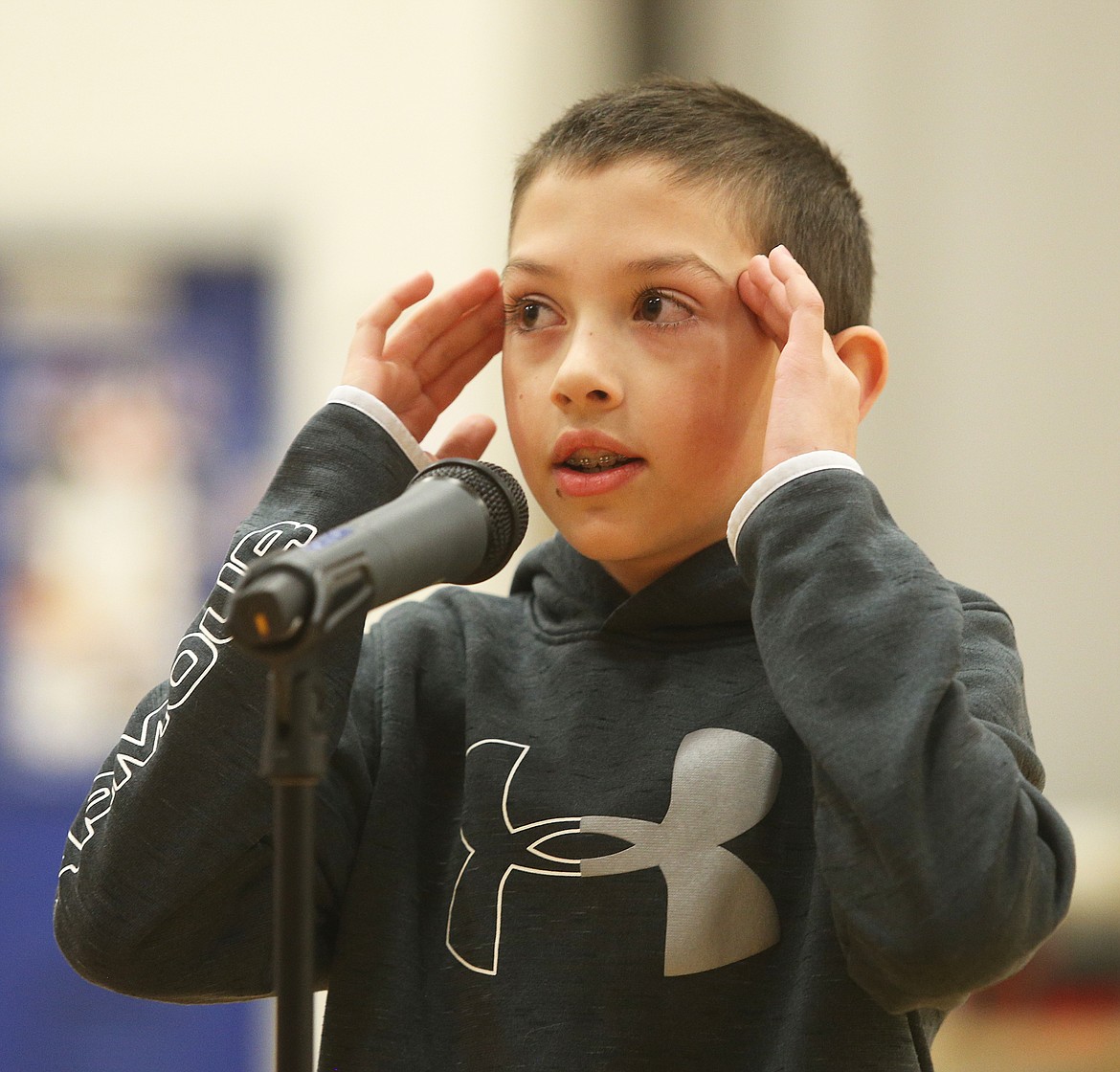 Fourth-grade student Kyler Webber searches his mental files as he recites the mathematical constant of pi during Seltice Elementary School's Pi Day competition. (LOREN BENOIT/Press)