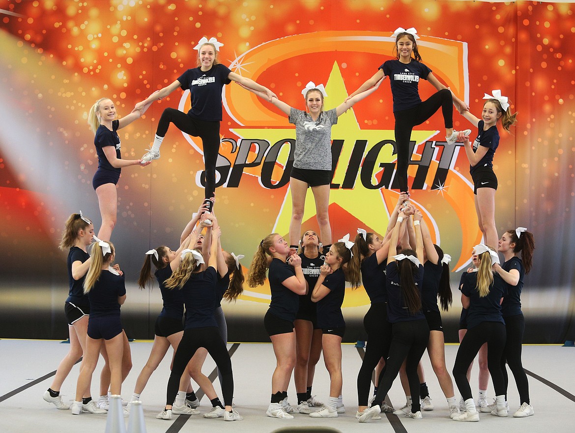 The Lake City High School Cheer team practices a stunt routine Wednesday at Spotlight Studios North Star in Hayden. Athletes on top, from left: Malea McAllister, Kenna Chilton, Shanay Branscome, Izzy Cochran and Kenzie Brock.