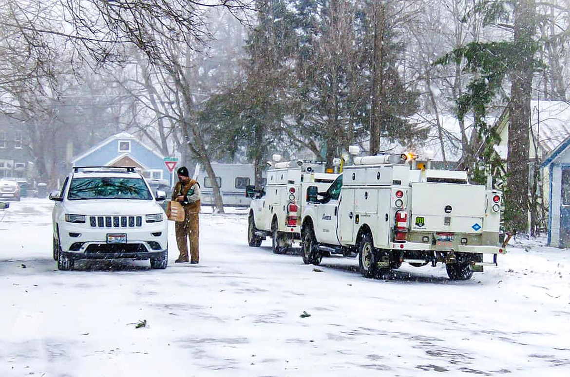 (Photo courtesy BAILEY BUTTERFIELD)
Avista crews getting a coffee break from family members as they work to restore power after Friday’s storm. “I’m so proud to call [Brian Scrimsher] my father,” she wrote in a Facebook post she shared with the Daily Bee. “I’ve never met a harder working person in my entire life. My dad and the rest of the Avista crew been out working nonstop since late last night. We were able to take him some coffee to warm up a bit, but he still has a long day ahead with trees down. Yes, things are hectic right now with the winter storm and such but just be thankful you’re alive and indoors! Say a little prayer for the hard workers out there braving the storm.”