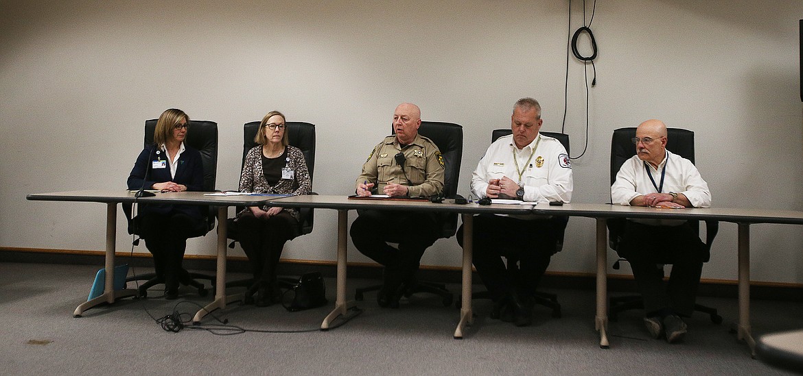 From left, Kootenai Health Director of Cummunication Kim Anderson, Panhandle Health Director Lora Whalen, Kootenai County Sheriff Ben Wolfinger, Kootenai County EMS Chief Officer Chris Way, and Kootenai County Commissioner Chris Fillios hold a press conference to answer questions about COVID-19,  false information on the social media platforms, and steps people can take to protect themselves. (LOREN BENOIT/Press)