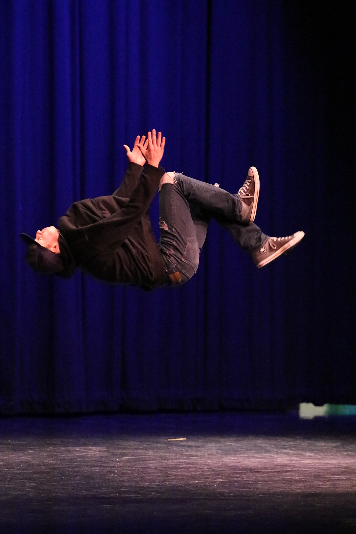 Photo by MANDI BATEMAN 
 Ty Bateman performs a backflip during the Mr. BFHS competition that took place at BFHS last Friday.