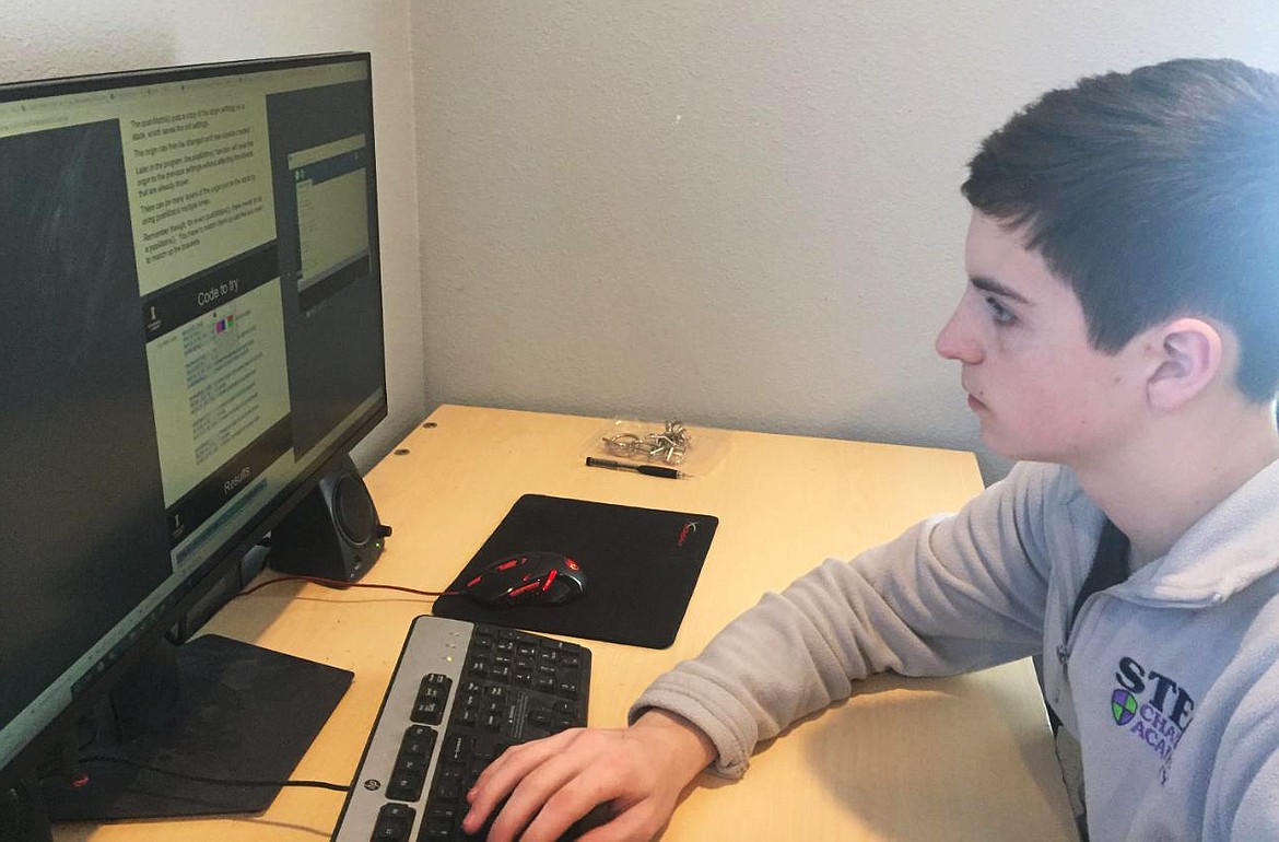 Josh McKenna, a North Idaho STEM Charter sophomore, works on taking notes for a math assignment at his home desktop computer Tuesday morning. Local charter students are continuing studies using online programs. Other area schools are encouraging educational activities as children are out of school during the coronavirus pandemic. (Courtesy photo)