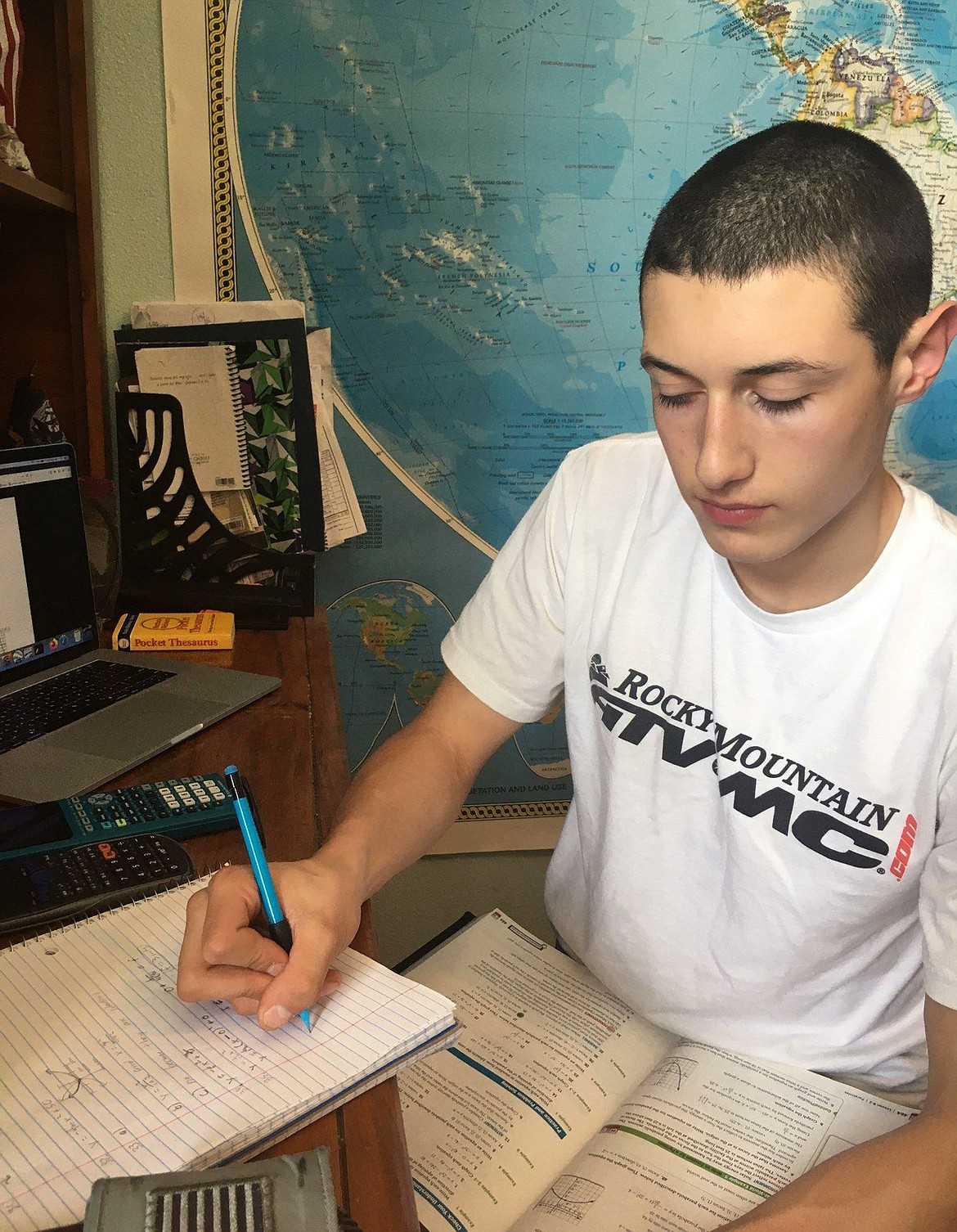 North Idaho STEM Charter sophomore Bronsen Fulk completes his math homework Tuesday using a lecture his teacher recorded for students as they continue learning at home. With schools closed for the pandemic, charter schools are going online while Coeur d’Alene schools are encouraging “At Home Learning.”