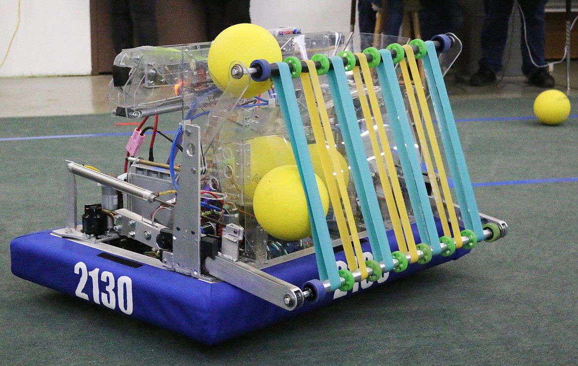 The robot picks up balls as it drives around.