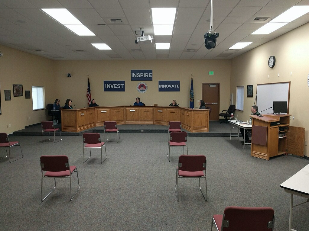 Chairs are spaced 6 feet apart during the special meeting of the Coeur d'Alene School Board on Wednesday night. The board voted to approve the school zone proposals from the boundary review committee, with two unanimous and one 4-to-1 vote. (Photo by SETH DENISTON)