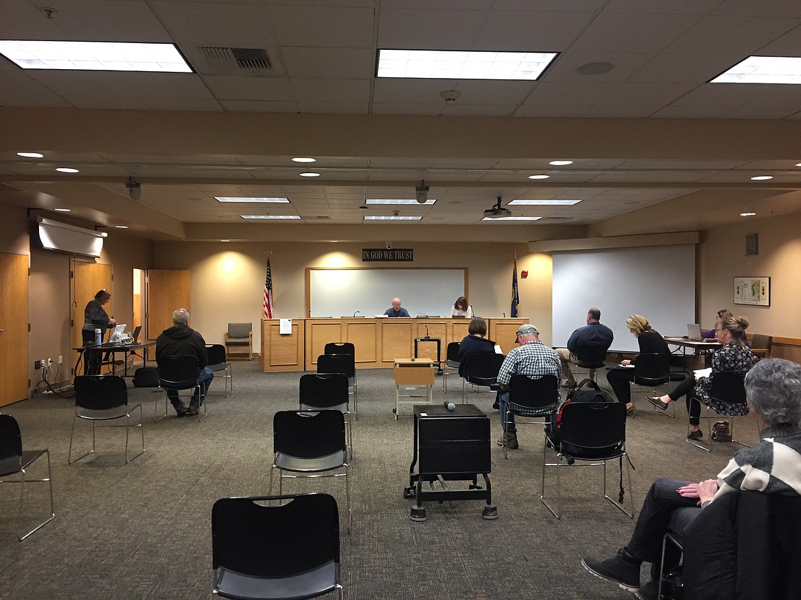 The Kootenai County Board of Commissioners meets to listen to a presentation by Dr. Myron Mills on Monday. Chairs are placed to accomodate CDC recommended distancing. (JENNIFER/PASSARO Press)