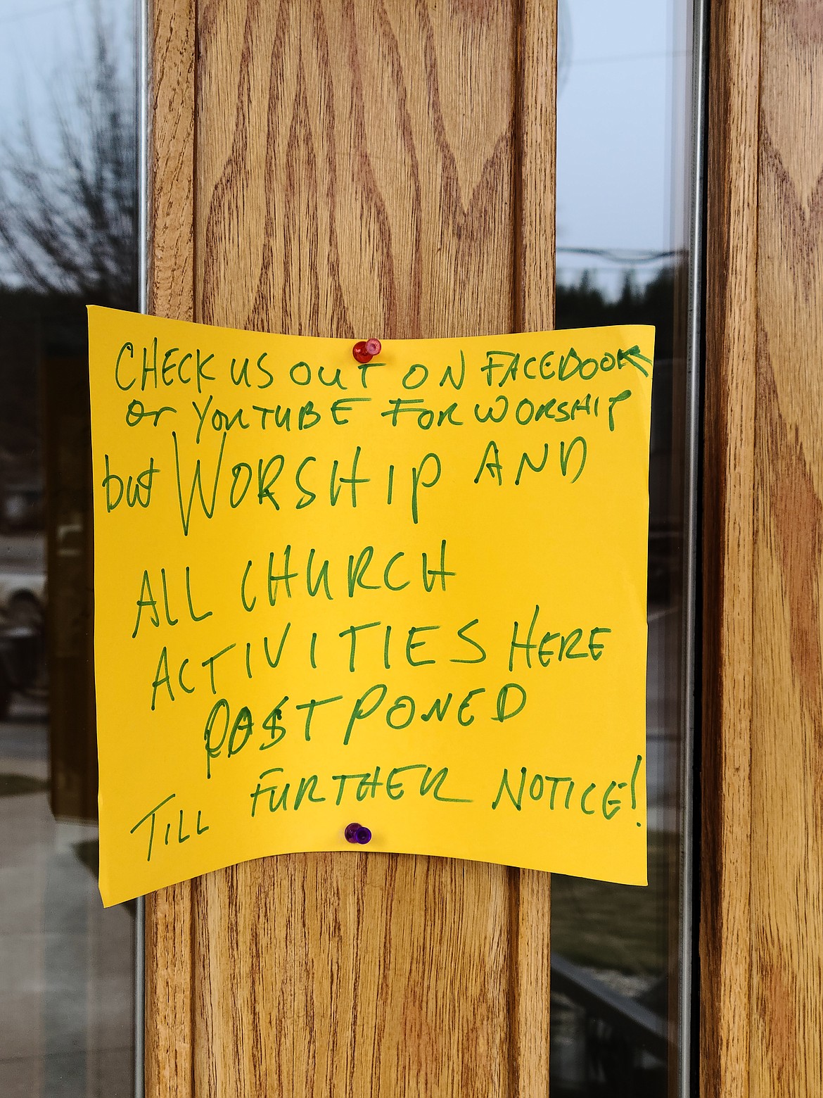 Photo by TONIA BROOKS 
 Signs like this one posted on the front entry to Trinity Lutheran Church can be found on most local places of worship in Boundary County during this time of social distancing.