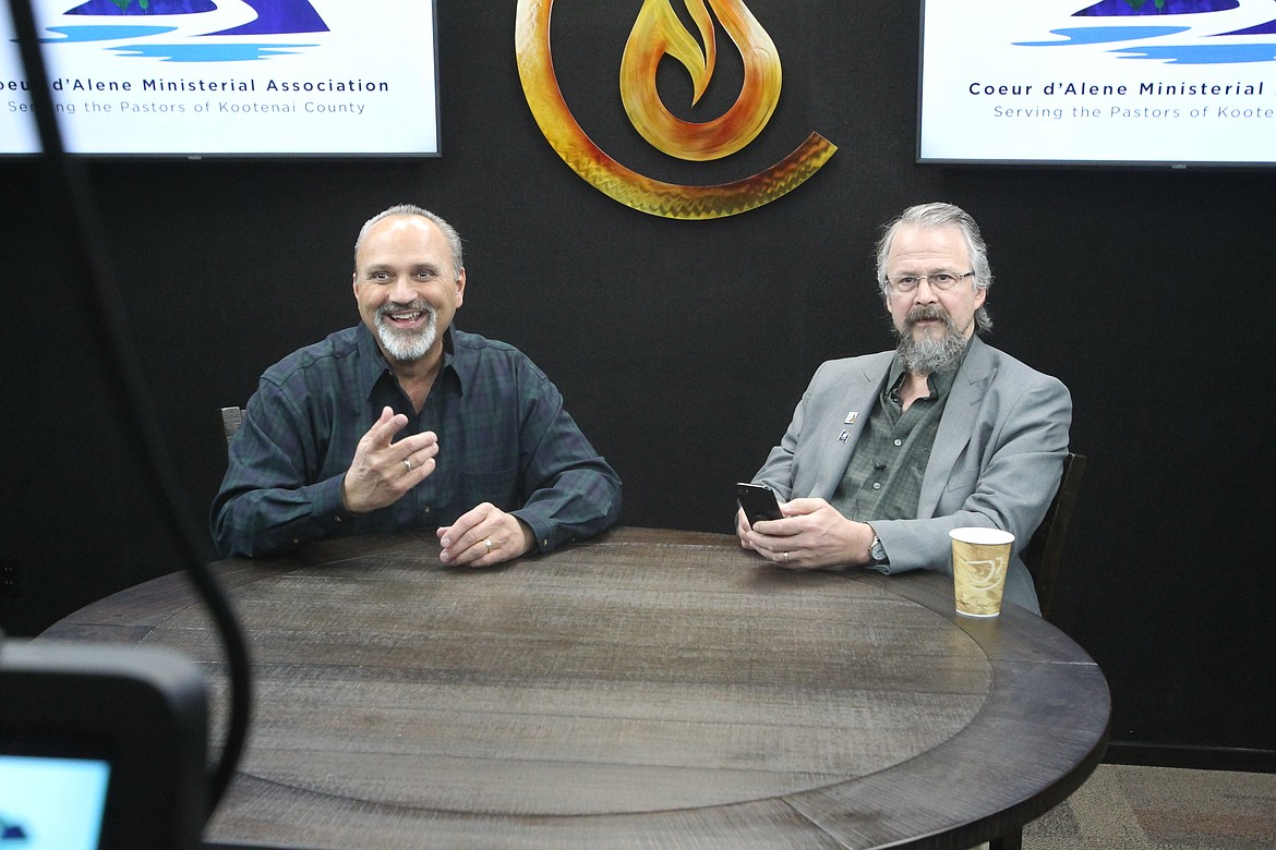BILL BULEY/Press 
 Pastor Paul Van Noy, left, and Rep. Tim Remington, also a pastor, prepare to record the opening statements that will air in a video to be released for Sunday's Day of Prayer in Kootenai County.