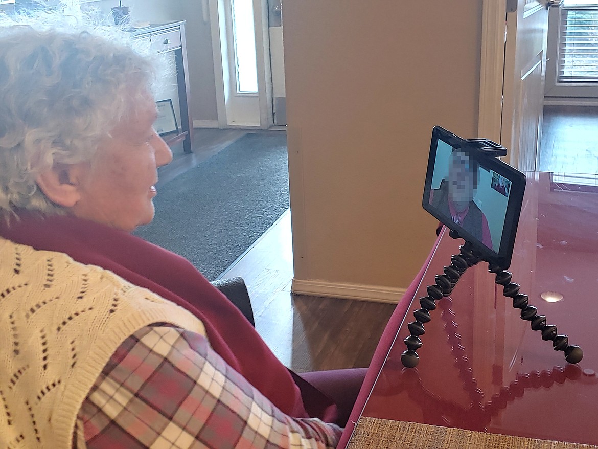 A resident at Guardian Angel Homes in Post Falls visits with a family member through virtual communication.