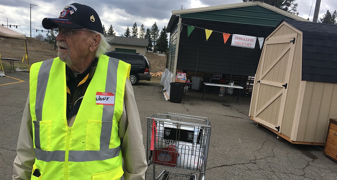 Wayne Brewer looks on as more donations arrive at the Rathdrum Senior Center on Thursday.