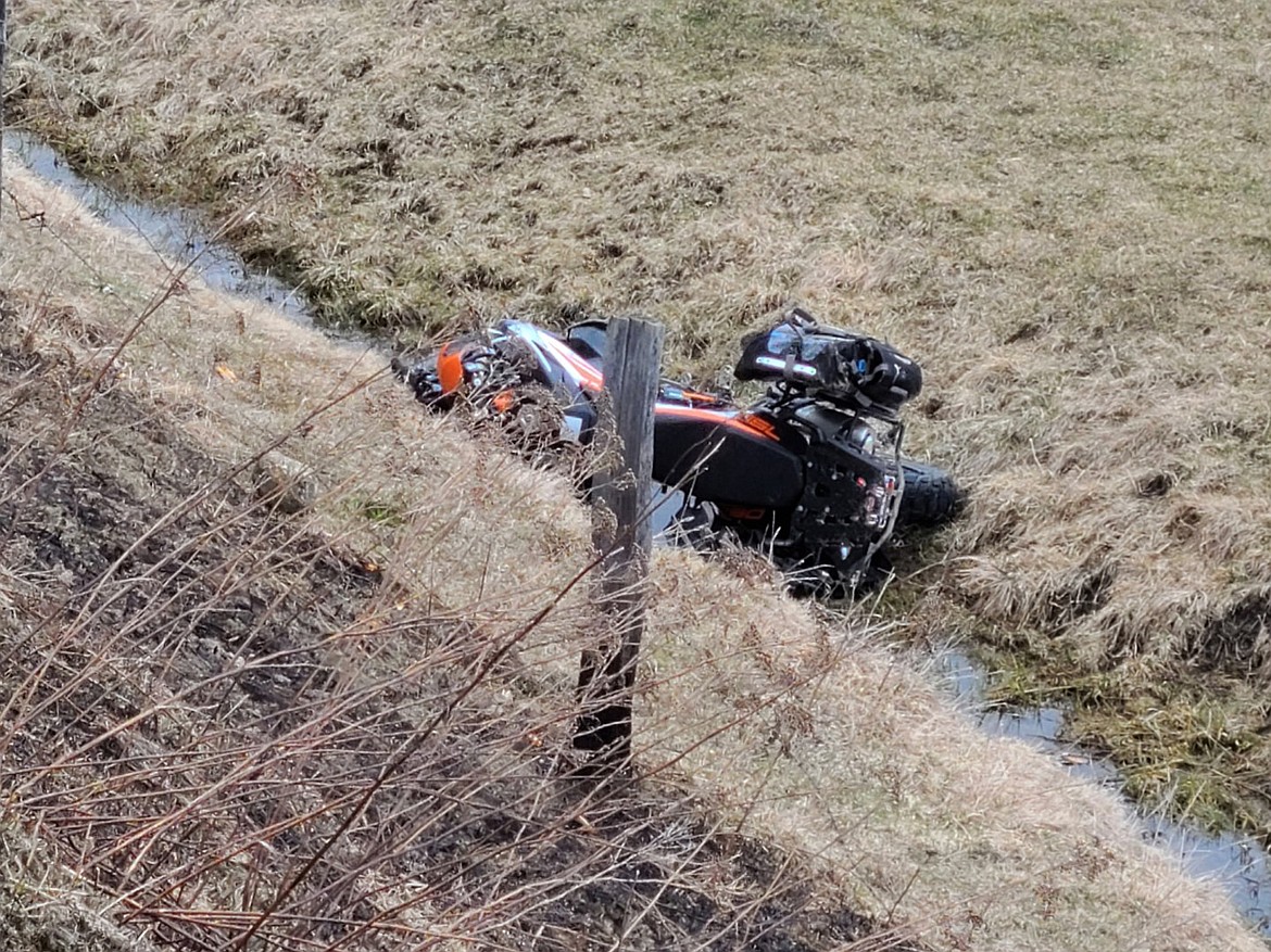 COURTESY PHOTO 
 The rider and motorcycle fell down a steep embankment after leaving the roadway.